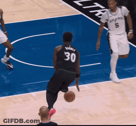 A Player With The Number 30 On Their Jersey Is Dribbling A Basketball GIF