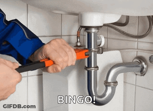 A Plumber Is Fixing A Sink Pipe With A Wrench And The Words Bingo Behind Him . GIF