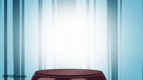 A Podium In Front Of A Blue Curtain With A Light Shining Through It GIF