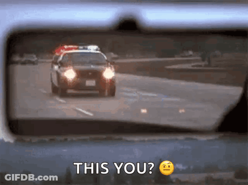 A Police Car Is Driving Down A Highway And The Rear View Mirror Says This You ? GIF