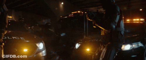 A Police Car Is Parked Next To A Ambulance GIF