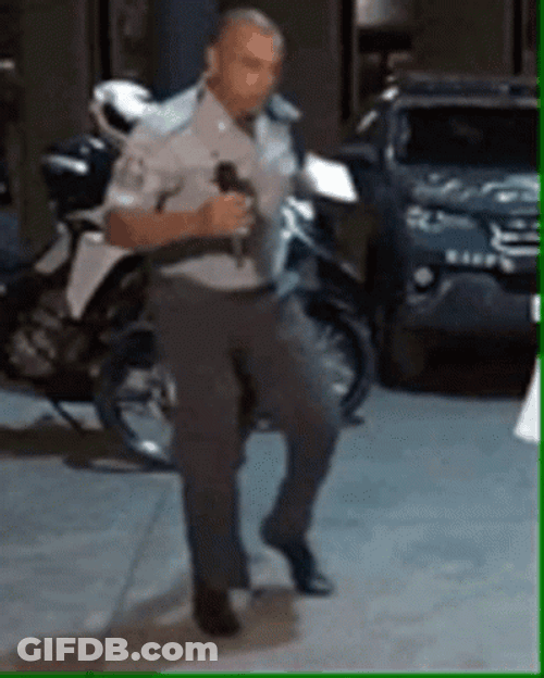A Police Officer Breakdancing GIF