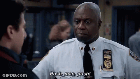 A Police Officer In A White Uniform And Tie Is Talking To Another Police Officer . GIF