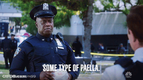 A Police Officer Is Holding A Bowl Of Paella And Talking To Another Police Officer .. GIF