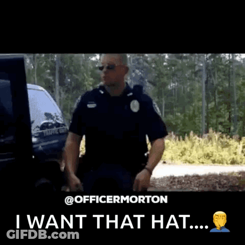 A Police Officer Is Holding A Hat In His Hand And Says I Want That Hat GIF
