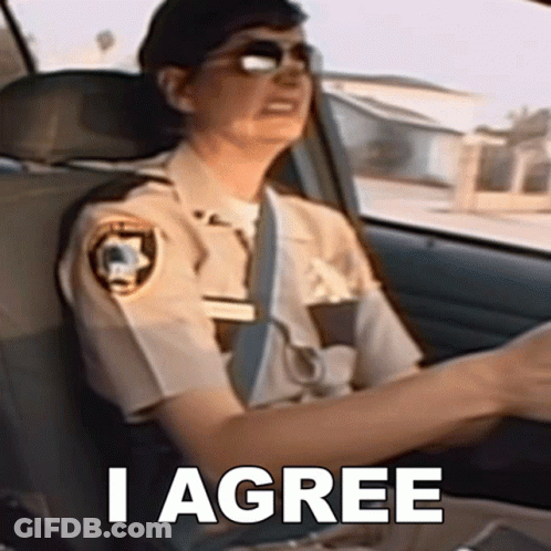 A Police Officer Is Sitting In The Driver 'S Seat Of A Car With The Words I Agree Above Her GIF