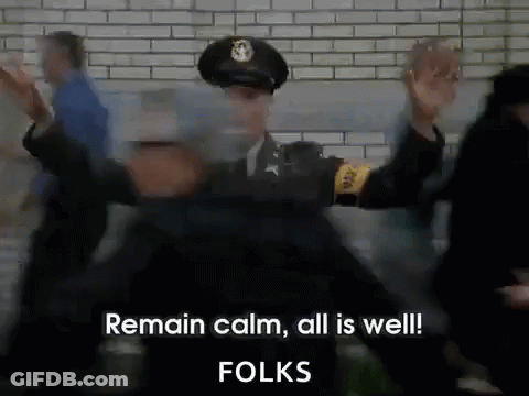 A Police Officer Is Standing In Front Of A Crowd And Says Remain Calm All Is Well Folks GIF