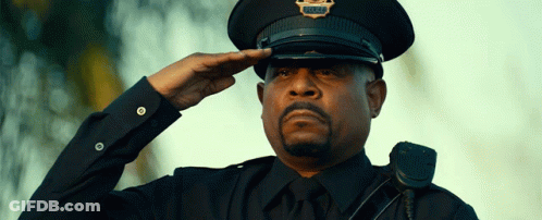 A Police Officer Salutes While Wearing A Hat That Says Police On It GIF