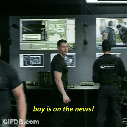 A Police Officer Says Boy Is On The News While Standing Next To Another Officer GIF