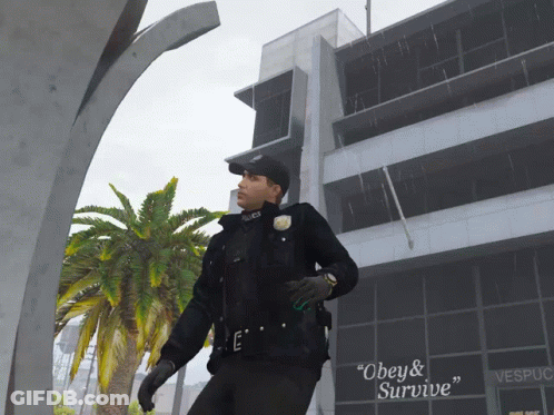 A Police Officer Standing In Front Of A Building That Says Vespucci GIF