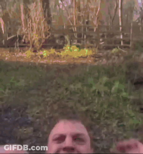 A Police Officer Wearing A Yellow Vest And Tie Is Screaming . GIF