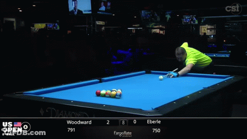 A Pool Table With A Blue Cloth And Balls On It GIF