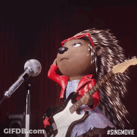 A Porcupine Is Singing Into A Microphone And Playing A Guitar . GIF