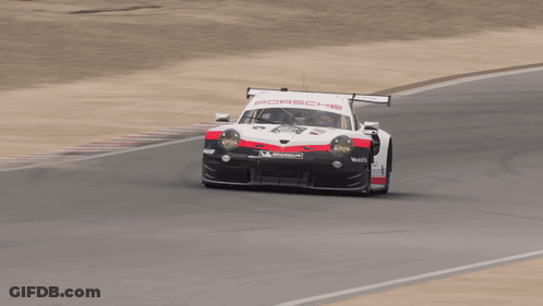 A Porsche Race Car Is On A Track GIF