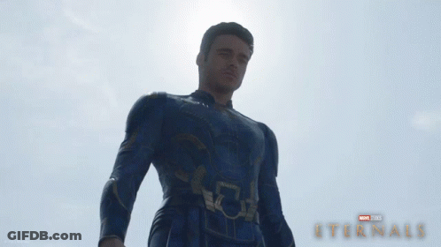 A Poster For A Movie Called Eternals With A Man In A Suit GIF