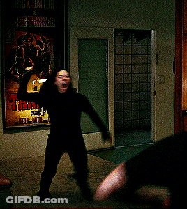A Poster For A Movie Called Tanner Hangs On A Wall Next To A Door GIF