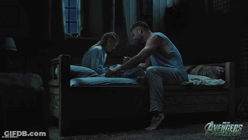 A Poster For Avengers Age Of Ultron Shows A Man And A Girl On A Bed GIF