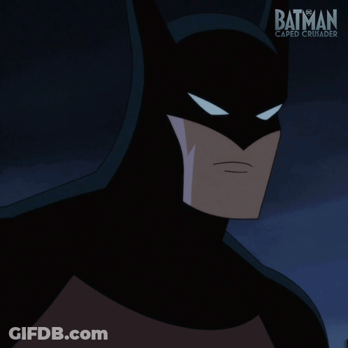 A Poster For Batman Caped Crusader Shows Batman In A Black Suit GIF