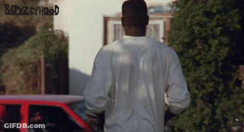A Poster For Boyz In The Hood Shows A Man Standing In Front Of A Car GIF