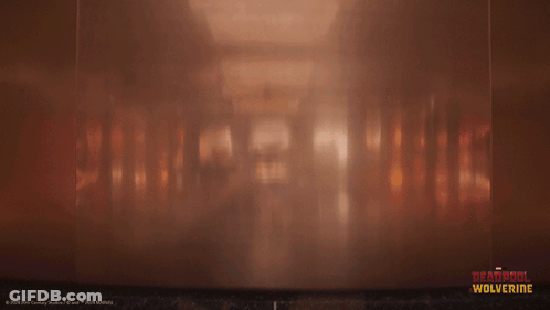 A Poster For Deadpool Wolverine Shows A Man In An Elevator GIF