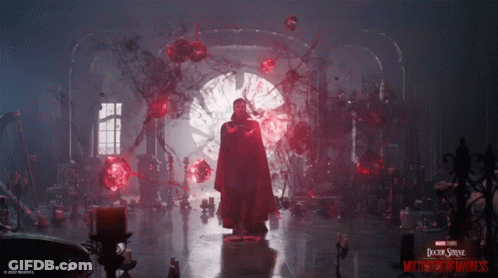 A Poster For Doctor Strange Multiverse Of Madness Features A Man In A Red Cloak GIF