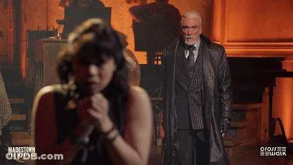 A Poster For Hadestown The Musical Shows A Man And Woman Singing GIF