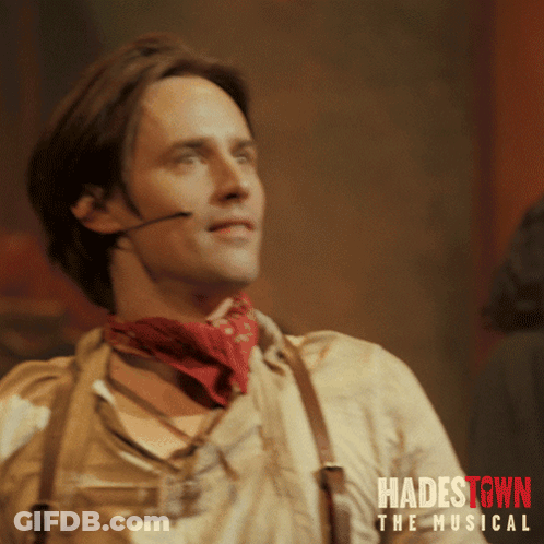 A Poster For Hadestown The Musical Shows A Man Wearing A Red Bandana GIF
