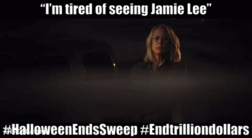 A Poster For Halloween Ends Sweep Shows A Woman In The Dark GIF