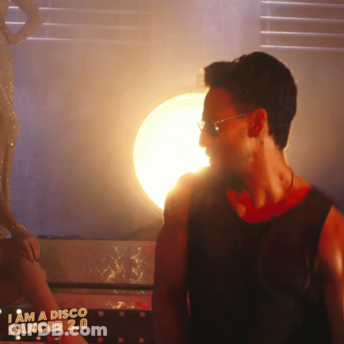 A Poster For I Am A Disco Dancer 2.0 Shows A Man And Woman Dancing GIF