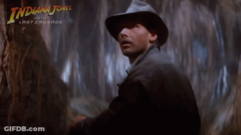 A Poster For Indiana Jones And The Last Crusade Features A Man In A Hat GIF
