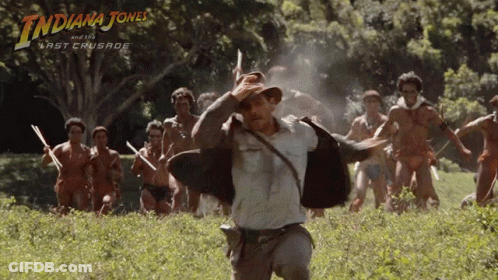A Poster For Indiana Jones And The Last Crusade Shows A Man Running In A Field GIF