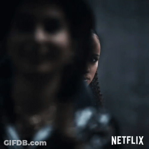 A Poster For Netflix Shows A Woman In A Black Jacket GIF