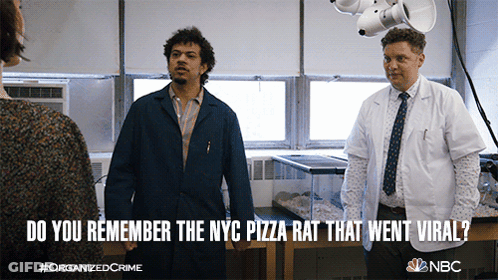 A Poster For Organized Crime Shows Two Men Standing Next To Each Other GIF