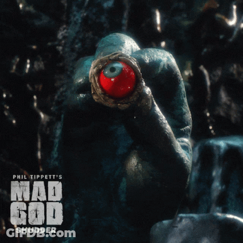 A Poster For Phil Tippett 'S Mad God Shudder Shows A Frog With A Red Eye GIF