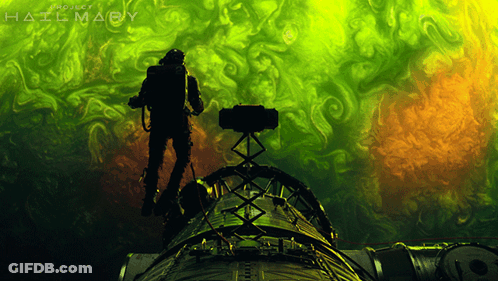 A Poster For Project Hailmary Shows A Man Standing On Top Of A Rocket GIF