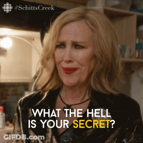 A Poster For Schitts Creek Shows A Woman With Red Lipstick GIF