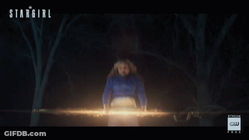 A Poster For Stargirl Shows A Woman In A Blue Shirt GIF