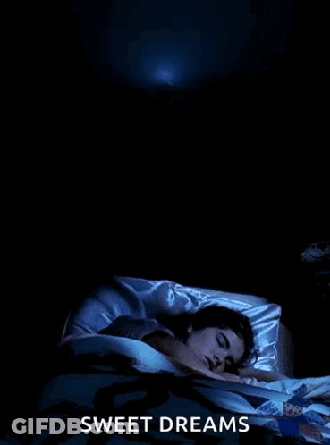 A Poster For Sweet Dreams Shows A Woman Sleeping In A Bed GIF