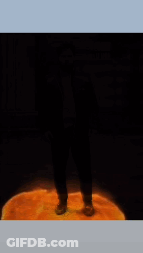 A Poster For Sweet Leaf Shows A Man Standing In Front Of A Fire GIF