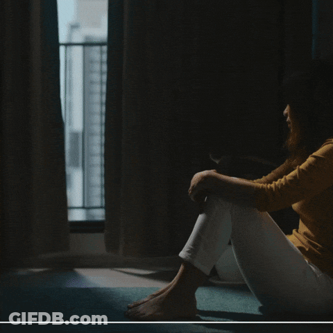 A Poster For Systemic Altruism Shows A Woman Sitting On The Floor GIF