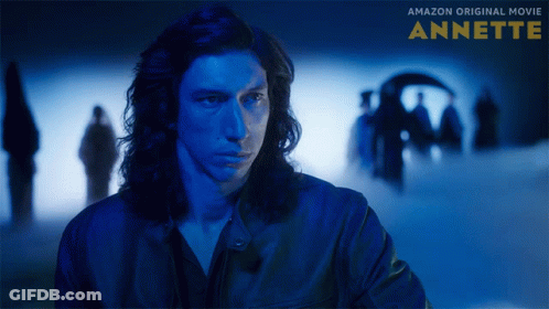 A Poster For The Amazon Original Movie Annette Showing A Man In A Blue Jacket GIF