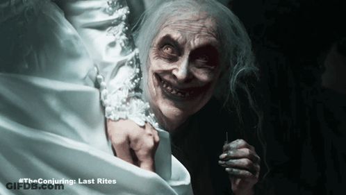A Poster For The Conjuring Last Rites Shows A Ghostly Woman GIF