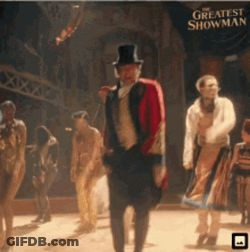 A Poster For The Greatest Showman With A Man In A Top Hat GIF