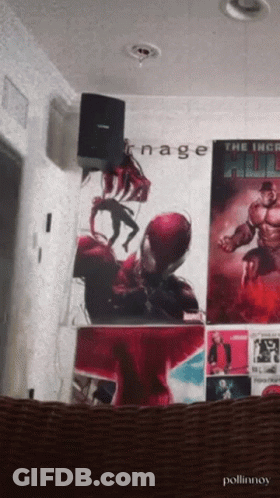 A Poster For The Incredible Hulk Hangs On A Wall With Other Posters GIF