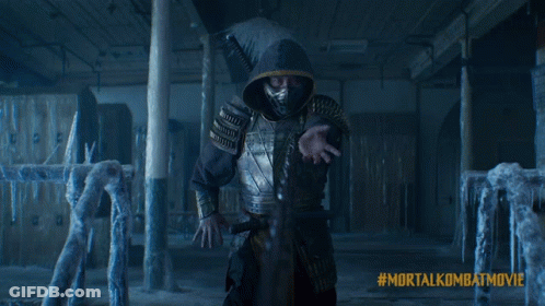 A Poster For The Mortal Kombat Movie Shows Two People Fighting GIF