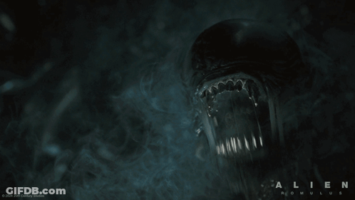 A Poster For The Movie Alien Is Shown With Smoke Coming Out Of It GIF