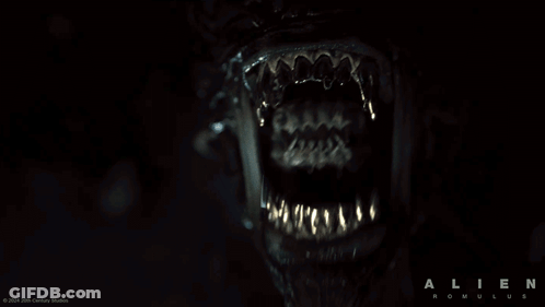 A Poster For The Movie Alien Romulus Shows A Close Up Of The Mouth GIF