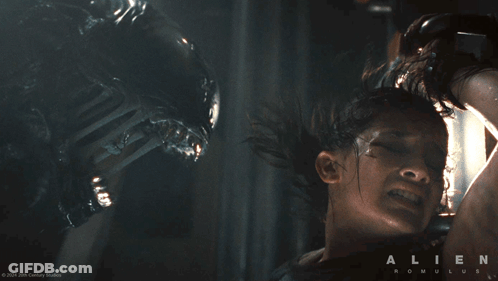 A Poster For The Movie Alien Romulus Shows A Man Being Attacked By An Alien GIF