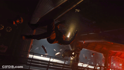 A Poster For The Movie Alien Shows A Man Falling GIF