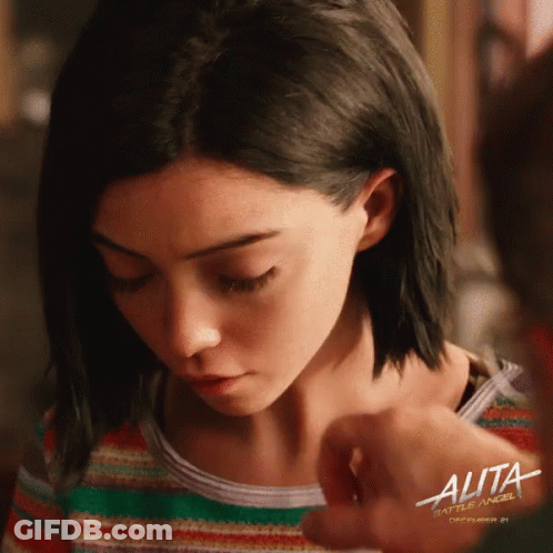 A Poster For The Movie Alita Shows A Girl Looking Down GIF